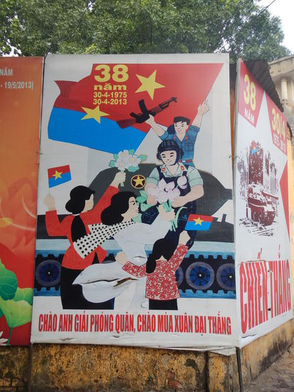 Auf den Strassen haengen ueberall Propaganda- Plakate
(HCMC)
