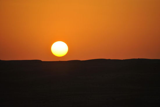 "So you run and you run to catch up with the sun but it's sinking 
Racing around to come up behind you again. 
The sun is the same in a relative way but you're older, 
shorter of breath and one day closer to death. 
(Pink Floyd)