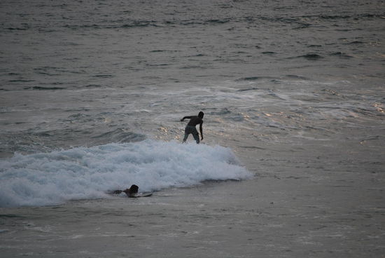 Boogieboarder im Sonnenuntergang