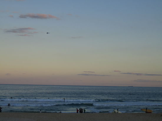 Bondi Beach at Sunset.
See all the surfers out there taking their last waves.