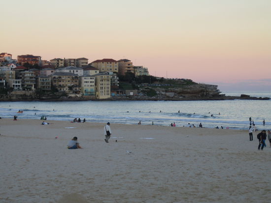 Surfers at Sunset and people relaxing at Sunset.