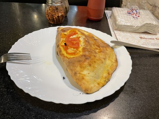 Pizza Calzone, sogar mit Ei