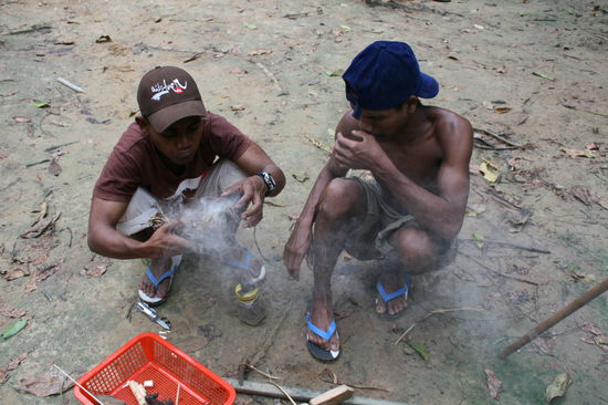Orang Asli making fire