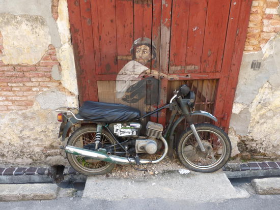 Streetart in Georgetown - der Junge auf dem Motorrad