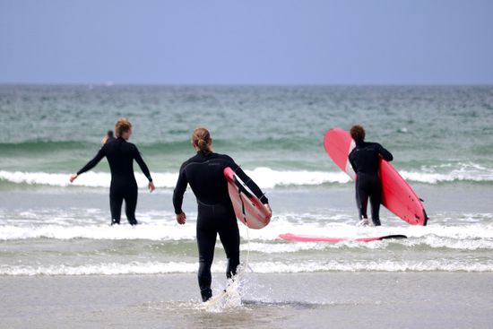 Surfer am Cox Bay Beach