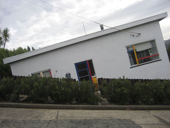 Baldwin Street, Worlds Steepest Street. If you turn the house to the right angle you can see how steep the street is.
