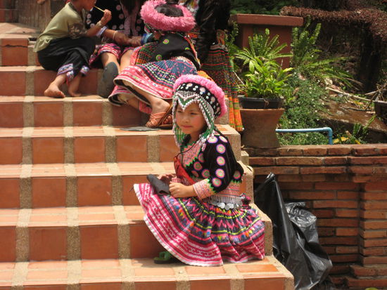 on the steps to the temple - kids in traditional cloths