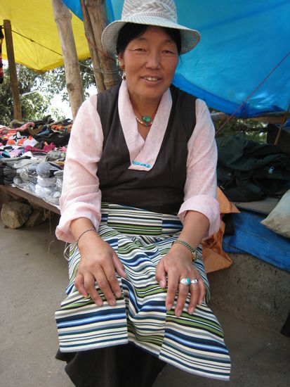 Saleslady in traditional cloth of Tibet