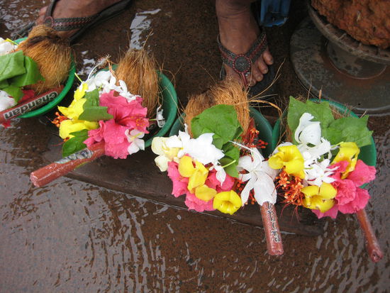 buy offerings for the gods in front of the Shri Mahalsa Temple, Goa, India