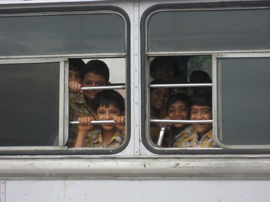 Schoolbus full of smiling kids, Mumbai, India