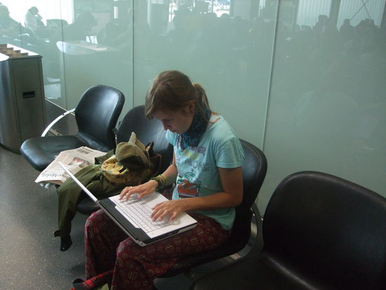 Am Reisebericht tippen.