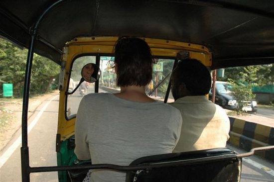 K is driving a rickshaw