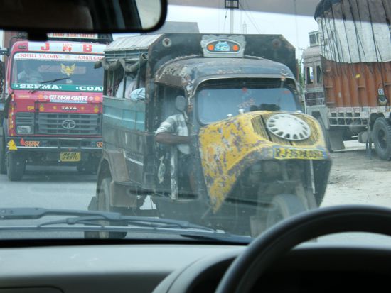 Transportmittel auf drei Rädern.