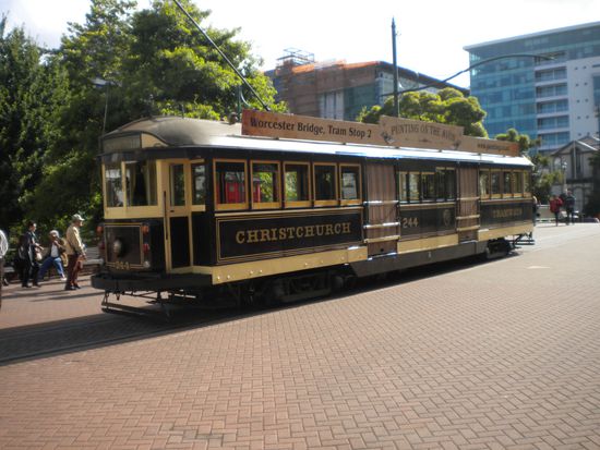 Old tram driving through the city.