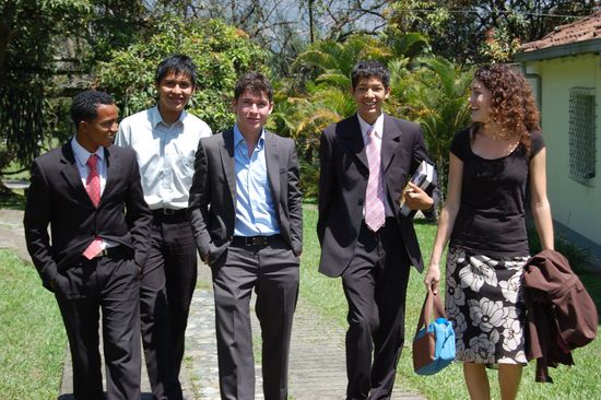 Men in black with woman 