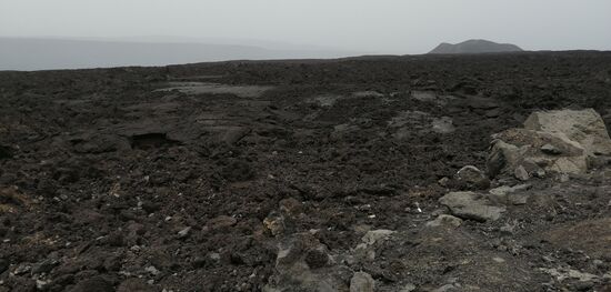 Der erste Blick auf den Ardwkwba- Vulkan , den man auch besteigen und umlaufen kann